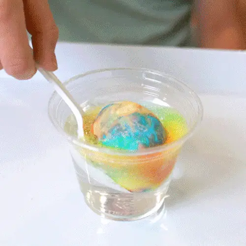 egg in fizzy color mixture