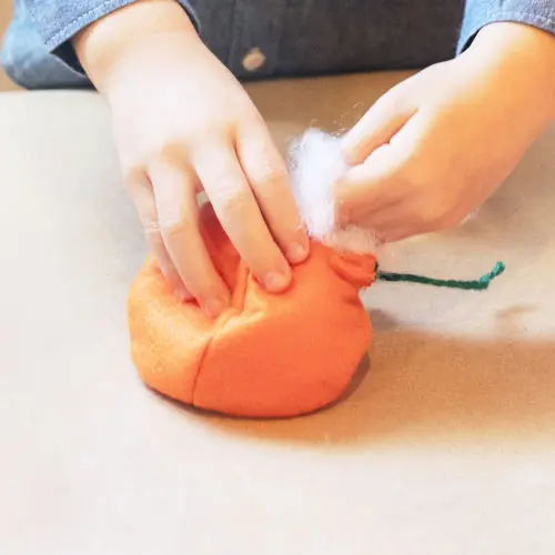 kid making pretend vegetables
